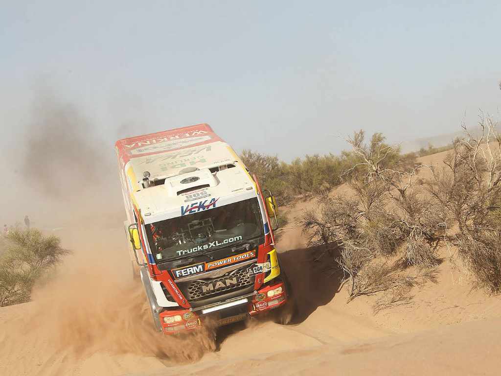 Racing truck during Dakar competition performing the latest suspension technology
